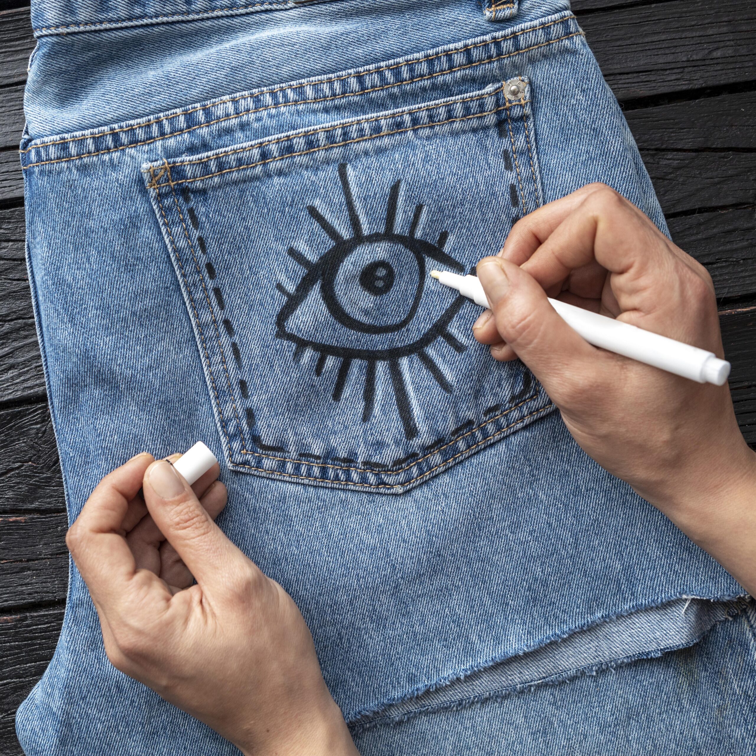 close-up-hand-drawing-jeans